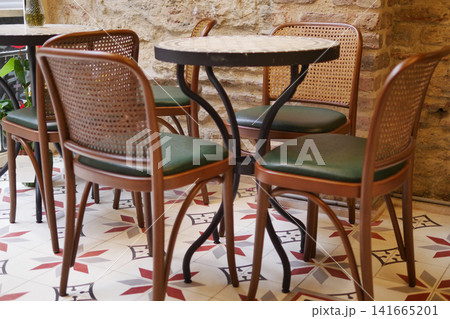 Empty cafe table and chairs in a cozy corner Empty cafe table and chairs in a cozy corner 141665201