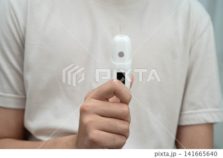 Man holding electronic cigarettes, no smoking. Man holding electronic cigarettes, no smoking. 141665640