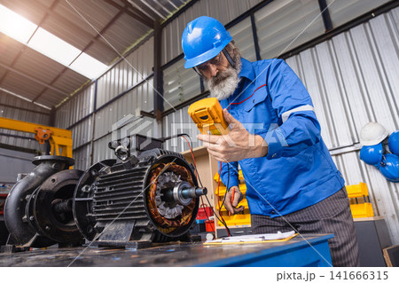 Senior Engineer Checking DC Motor, Technician in Garage check inspecting service maintenance Stator. Senior Engineer Checking DC Motor, Technician in Garage check inspecting service maintenance Stator. 141666315