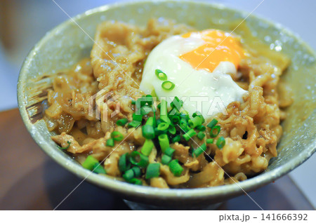 Rice topped with stir fried pork or stir fried beef and egg or Japanese food or Korean food or Beef Rice Bowl , Gyudon Rice topped with stir fried pork or stir fried beef and egg or Japanese food or Korean food or Beef Rice Bowl , Gyudon 141666392