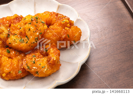 Crispy fried chili shrimp tossed in sweet and spicy sauce, Asian Chinese food style Crispy fried chili shrimp tossed in sweet and spicy sauce, Asian Chinese food style 141668113