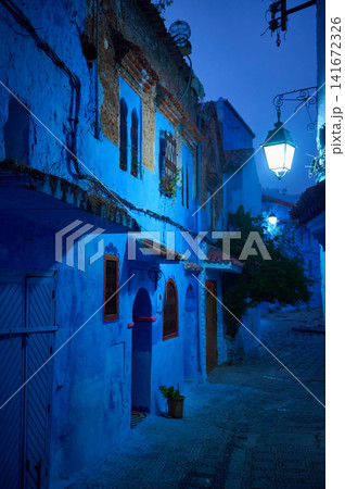 Blue-painted street in Chefchaouen at night with glowing lanterns and quiet alleys Blue-painted street in Chefchaouen at night with glowing lanterns and quiet alleys 141672326