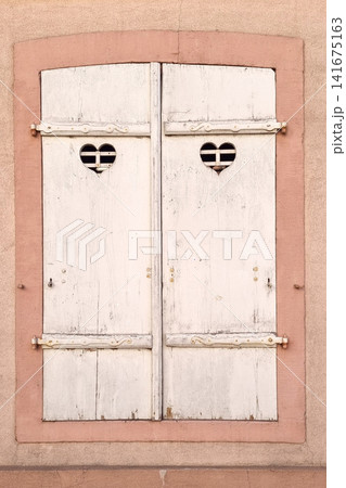 Vintage Wooden Shuttered Window with Heart Cutouts for Rustic Home Decor or Travel Photography Vintage Wooden Shuttered Window with Heart Cutouts for Rustic Home Decor or Travel Photography 141675163