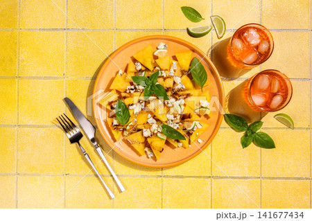 Watermelon salad with blue cheese, basil and refreshing spritz Watermelon salad with blue cheese, basil and refreshing spritz 141677434