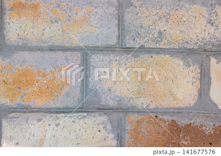Weathered brick wall pattern background texture close up Weathered brick wall pattern background texture close up 141677576