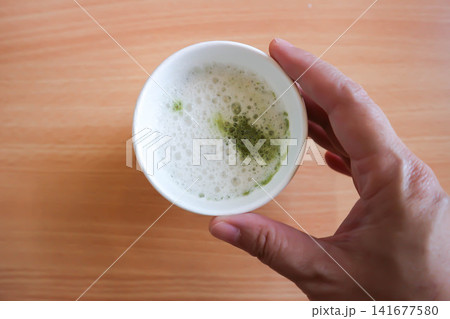 green tea or matcha green tea, milk green tea or matcha latte or matcha green tea latte in the paper glass green tea or matcha green tea, milk green tea or matcha latte or matcha green tea latte in the paper glass 141677580