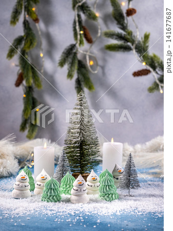 Snowman meringue cookies and festive fir tree decorations Snowman meringue cookies and festive fir tree decorations 141677687