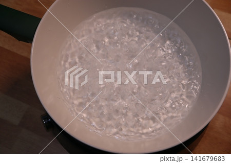 Boiling Water in Pot on Stove Boiling Water in Pot on Stove 141679683