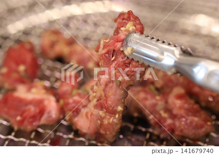Grilling Raw Marinated Meat on Grill Grilling Raw Marinated Meat on Grill 141679740