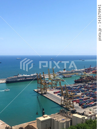 Panoramic view of the Port of Barcelona in Spain with container terminal cranes, cargo vessels and cruise liners on the Mediterranean in summer. Useful for travel, shipping, logistics and global trade Panoramic view of the Port of Barcelona in Spain with container terminal cranes, cargo vessels and cruise liners on the Mediterranean in summer. Useful for travel, shipping, logistics and global trade 141679941