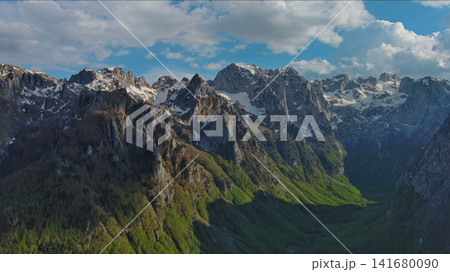 Rocky snow mountains before sunset aerial Rocky snow mountains before sunset aerial 141680090