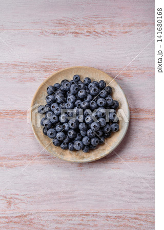 Fresh, ripe, and juicy wild blueberries as an ingredient for vegetarian dishes Fresh, ripe, and juicy wild blueberries as an ingredient for vegetarian dishes 141680168