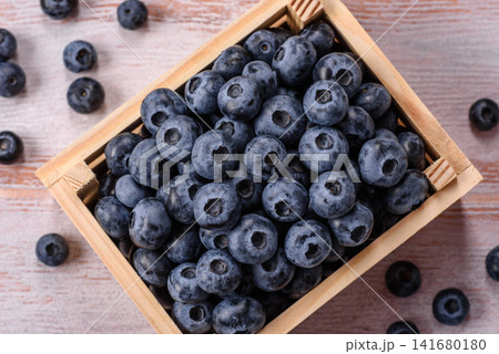 Fresh, ripe, and juicy wild blueberries as an ingredient for vegetarian dishes Fresh, ripe, and juicy wild blueberries as an ingredient for vegetarian dishes 141680180