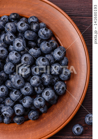 Fresh, ripe, and juicy wild blueberries as an ingredient for vegetarian dishes Fresh, ripe, and juicy wild blueberries as an ingredient for vegetarian dishes 141680193