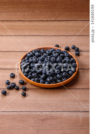 Fresh, ripe, and juicy wild blueberries as an ingredient for vegetarian dishes Fresh, ripe, and juicy wild blueberries as an ingredient for vegetarian dishes 141680199