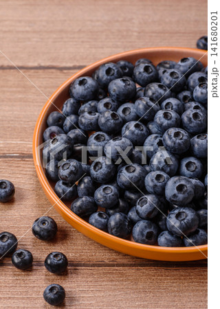 Fresh, ripe, and juicy wild blueberries as an ingredient for vegetarian dishes 141680201