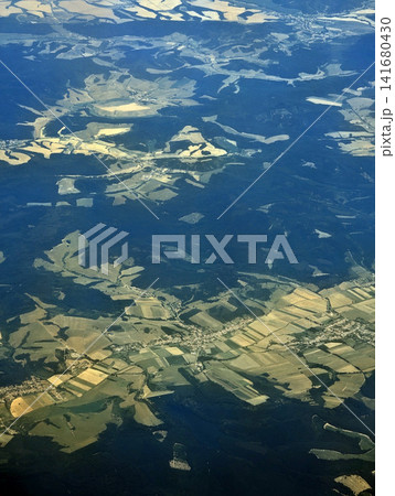 Flying Above fluffy Clouds with Dramatic Scenic Landscape View From High Altitude Flying Above fluffy Clouds with Dramatic Scenic Landscape View From High Altitude 141680430