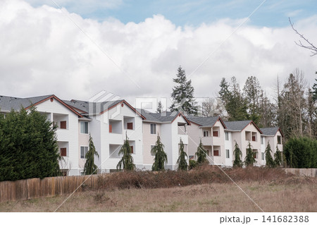 A row of modern white multi-family apartment buildings under a cloudy sky - March, 09 2026, Milton WA, USA A row of modern white multi-family apartment buildings under a cloudy sky - March, 09 2026, Milton WA, USA 141682388