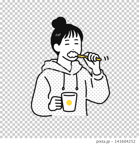 一位頭髮綁起來的年輕女子正在刷牙。 一位頭髮綁起來的年輕女子正在刷牙。 141684252