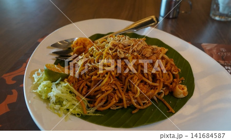 Delicious Mee Goreng Dish with Shrimp and Calamansi Delicious Mee Goreng Dish with Shrimp and Calamansi 141684587
