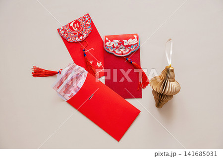 Red envelope with money for Lunar New Year celebration. 141685031