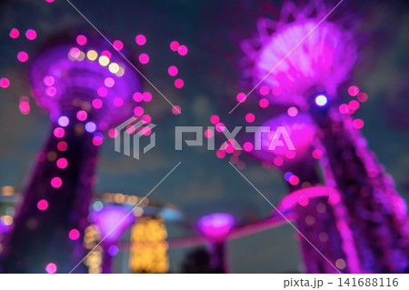 Blurred background of supertree Grove purple light up at night, Singapore Blurred background of supertree Grove purple light up at night, Singapore 141688116