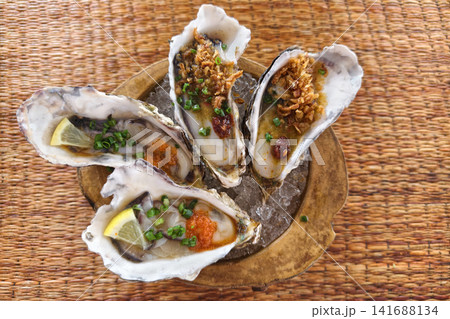 fresh oysters with tobiko fish in Japanese restaurant fresh oysters with tobiko fish in Japanese restaurant 141688134