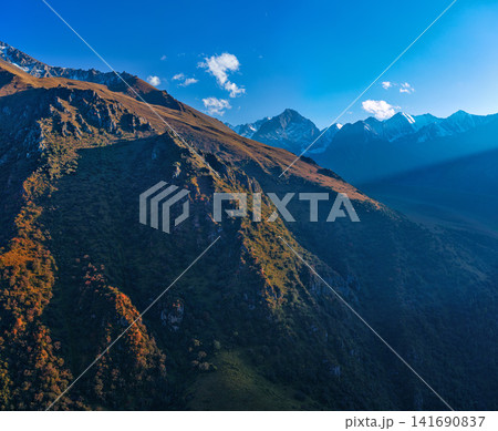 Majestic Mountain Landscape with Sunbeams in Kyrgyzstan Majestic Mountain Landscape with Sunbeams in Kyrgyzstan 141690837
