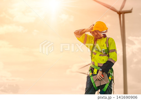 Tired fatigue Sweating Worker working outdoors with extreme heatwave bad weather intense UV sunlight Tired fatigue Sweating Worker working outdoors with extreme heatwave bad weather intense UV sunlight 141690906