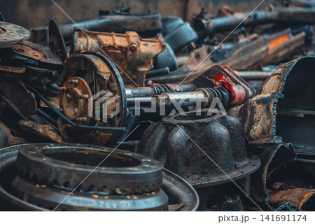 rusty automotive and motorcycle parts piled in industrial scrapyard metal recycling zone, damaged mechanical components and corroded vehicle machinery in salvage dump background rusty automotive and motorcycle parts piled in industrial scrapyard metal recycling zone, damaged mechanical components and corroded vehicle machinery in salvage dump background 141691174
