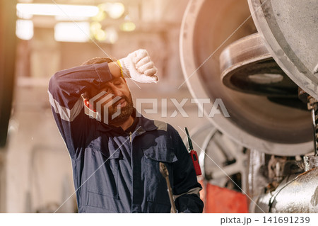 Heatwave effect, Hot tired exhausted fatigue working people in industry, Engineer man worker sweat. Heatwave effect, Hot tired exhausted fatigue working people in industry, Engineer man worker sweat. 141691239