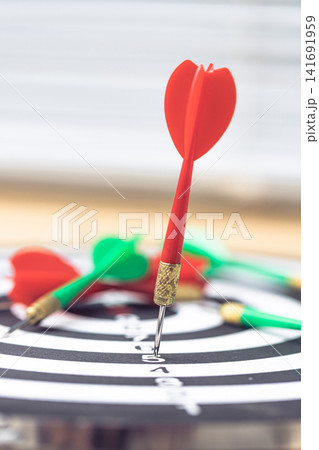 Dart arrow on target for business Competition Concept With One Clear Winning Target 141691959