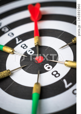 Dart arrow on target for business Competition Concept With One Clear Winning Target Dart arrow on target for business Competition Concept With One Clear Winning Target 141691960