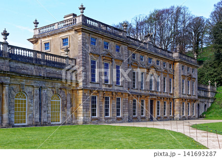 The majestic baroque facade of Dyrham Park mansion house set against rolling hills in South Gloucestershire, England The majestic baroque facade of Dyrham Park mansion house set against rolling hills in South Gloucestershire, England 141693287