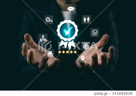 Businessman open hands presenting glowing quality guarantee badge with five stars rating, concept of customer satisfaction and premium service. Businessman open hands presenting glowing quality guarantee badge with five stars rating, concept of customer satisfaction and premium service. 141693626