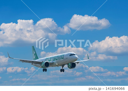 July 30, 2026. Netherlands, Amsterdam. Transavia Passenger Plane Approaching July 30, 2026. Netherlands, Amsterdam. Transavia Passenger Plane Approaching 141694066