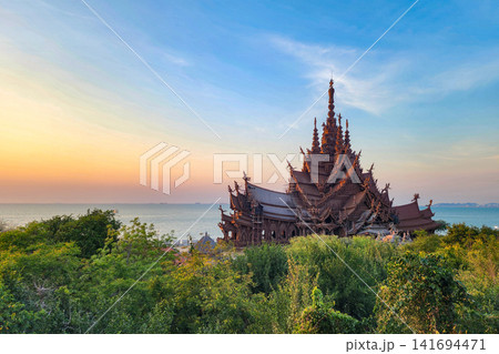 Sanctuary of Truth wooden temple overlooking the Gulf of Thailand at sunset in Pattaya Sanctuary of Truth wooden temple overlooking the Gulf of Thailand at sunset in Pattaya 141694471