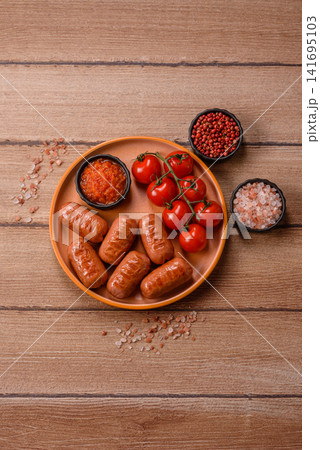 Chicken or pork grilling sausages with garlic, salt, and spices. Grilling sausages Chicken or pork grilling sausages with garlic, salt, and spices. Grilling sausages 141695103
