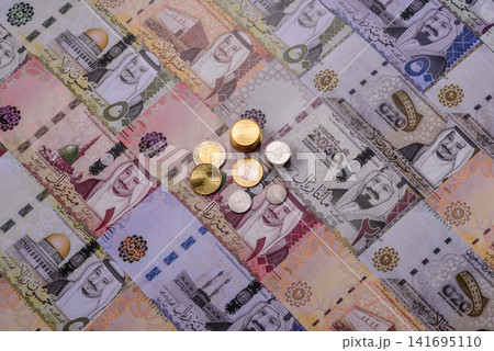 Saudi Arabia paper money, riyal banknotes and coins as currency for exchange. Saudi Arabia money Saudi Arabia paper money, riyal banknotes and coins as currency for exchange. Saudi Arabia money 141695110
