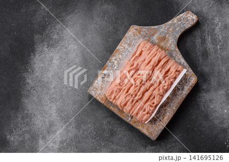 Fresh raw ground chicken, poultry meat for home cooking. Ground chicken Fresh raw ground chicken, poultry meat for home cooking. Ground chicken 141695126