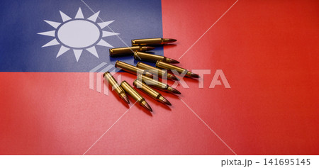 Assault rifle cartridges on the taiwanese flag, serving as a conceptual background for defense Assault rifle cartridges on the taiwanese flag, serving as a conceptual background for defense 141695145