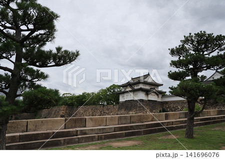 Historic Osaka Castle surrounded by gardens in Osaka Japan 141696076