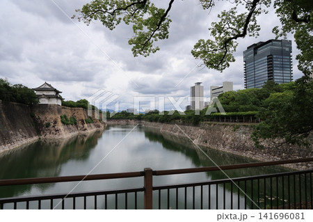 Historic Osaka Castle surrounded by gardens in Osaka Japan Historic Osaka Castle surrounded by gardens in Osaka Japan 141696081