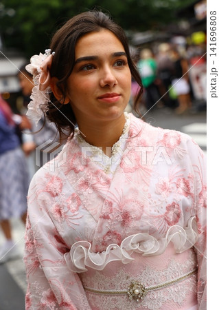 Teenage girl wearing a traditional kimono in Kyoto Japan 141696808
