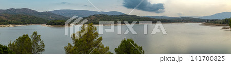 Beniarres reservoir view surrounded by hills and mountains in Alicante Spain at sunset Beniarres reservoir view surrounded by hills and mountains in Alicante Spain at sunset 141700825
