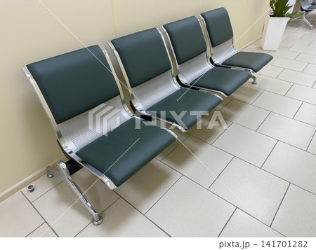 Vacant area with green chairs Vacant area with green chairs 141701282