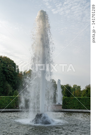 Daytime fountain water sprays up Daytime fountain water sprays up 141701289