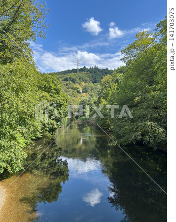 Scenic view of the Wupper river with Diederichstempel pavilion on the forested hill, Solingen, Germany Scenic view of the Wupper river with Diederichstempel pavilion on the forested hill, Solingen, Germany 141703075