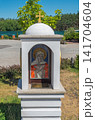 Street chapel or worship pillar with mosaic icon of the Holy Mother of God 141704604