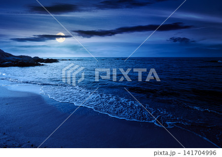 black sea landscape in summer at night. full moon over bulgaria nature landscape with sandy beach. mysterious summer vacation at the sea shore concept. waves and empty beach. remote vacation scene 141704996